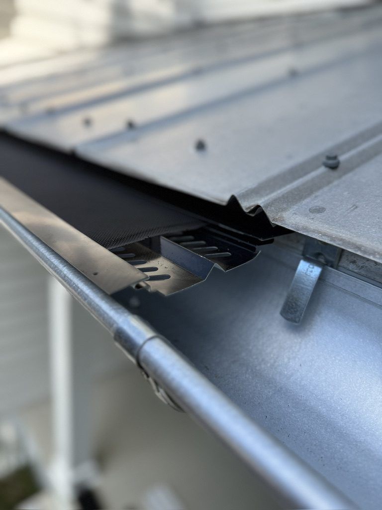Close-up of a seamless gutter and hanger