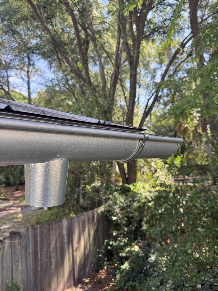 Half-round gutter and downspout on a Charleston home